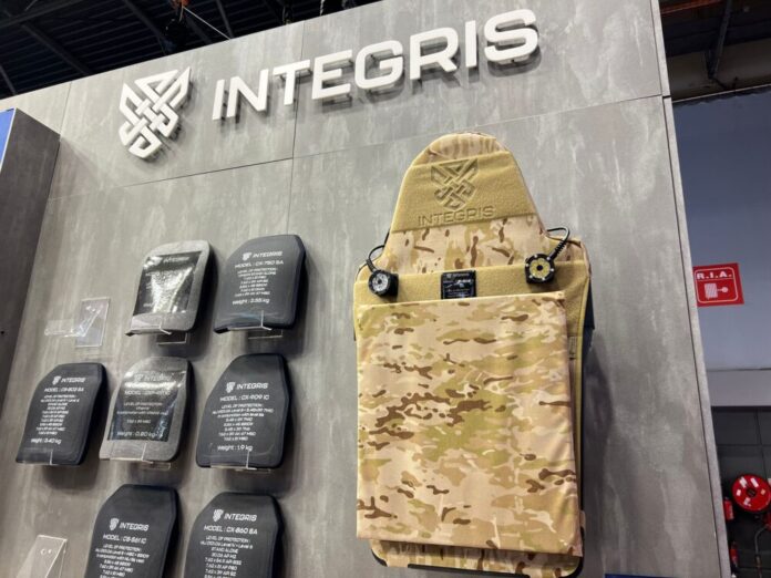 Integris Composites' hard ballistic plates and plate carrier at their booth at Milipol Paris 2023