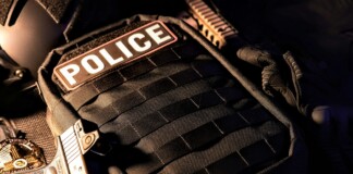 Built for the Mission: The Future of Custom Armor Systems Close-up of a police tactical vest with integrated body armor, highlighting modern ballistic protection equipment used by law enforcement in operational environments.
