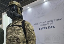 Hotter Than the Summer Sun: Eurosatory 2026 Brought the Heat A body armor displayed on a mannequin with a tactical helmet, set against backdrop featuring the message “Protecting those that protect us everyday.”