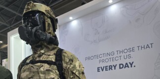 Hotter Than the Summer Sun: Eurosatory 2026 Brought the Heat A body armor displayed on a mannequin with a tactical helmet, set against backdrop featuring the message “Protecting those that protect us everyday.”