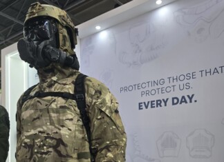 Hotter Than the Summer Sun: Eurosatory 2026 Brought the Heat A body armor displayed on a mannequin with a tactical helmet, set against backdrop featuring the message “Protecting those that protect us everyday.”